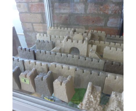 A collection of Wargaming resin type castle walls, 20cm x 10cm sections, three gate sections, nine corners and two stairways 