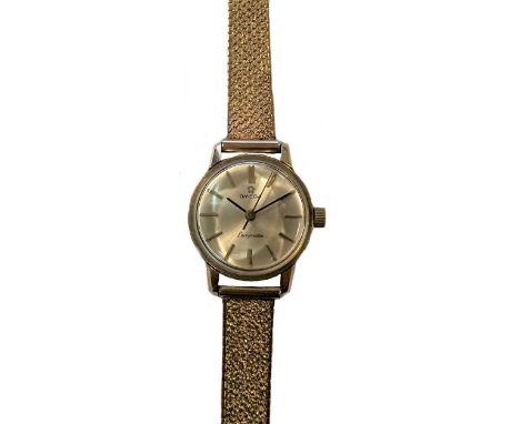 Omega - A 9ct gold 'Ladymatic' wristwatch on a later 9ct gold bracelet, circa 1970, model number 1061, the signed circular si