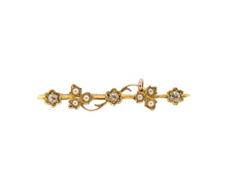 An early 20th century diamond and split pearl brooch, three flowers, each set with an old European cut diamond, approximate d