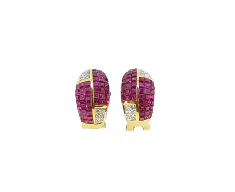 A pair of modern ruby and diamond half hoops, each with two sections of calibré cut rubies, and two sections of grain set rou