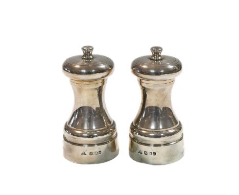 A pair of Elizabeth II silver condiment grinders, mark of J.A.Campbell, Birmingham 1986, each of traditional capstan form wit