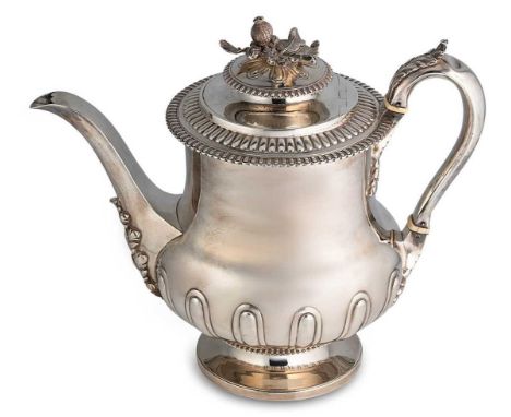 A George III silver coffee pot, mark of Samuel Hennell, London 1812, of baluster half fluted form, the side engraved with an 