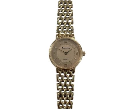 Bulova - A wristwatch, circa 2006, the signed circular two-tone champagne dial, 20mm diameter, with gold coloured batons and 