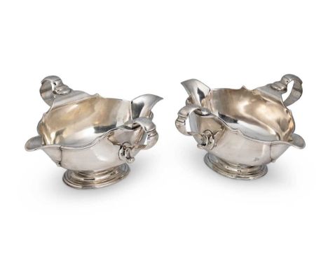 A pair of George V silver sauce boats of unusual design, mark of William Comyns &amp; Sons Ltd., (Charles &amp; Richard Comyn