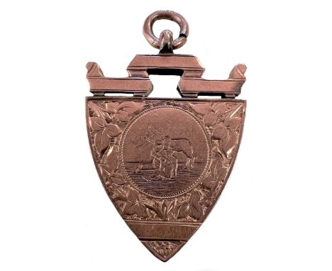 An early 20th century 9ct rose gold fob medal, mark of James Fenton &amp; Co., Birmingham 1901, of shield shaped form with sa