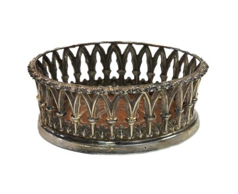 A William IV silver bottle coaster, mark of Henry Wilkinson &amp; Co., Sheffield 1836, the sides pierced with symmetrical des