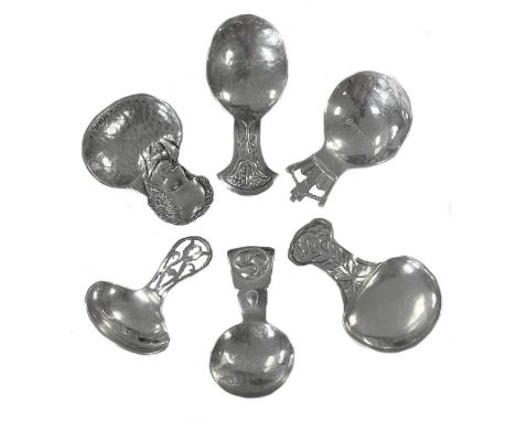 A collection of six silver 'Arts & Crafts' and later caddy spoons, first, mark of Florence Stern, Birmingham 1911, D shaped b