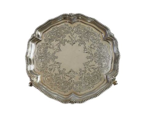 A Victorian silver waiter, mark of Goldsmiths Alliance Ltd., London 1870, 'Chippendale' style with beaded rim, the field with