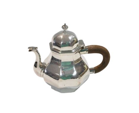 A George V silver bachelor's teapot, mark of Alfred James How, London 1910, in the Turkish style, of octagonal panelled form,