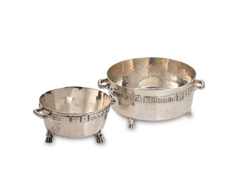 Two early 20th century 'Arts &amp; Crafts' silver bowls, both of circular form and hammered finish, the side with applied Med