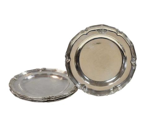 A set of four George III 18th century silver dinner plates, mark of John Parker I & Edward Wakelin, London 1770, each with re