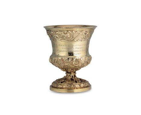 A George IV silver gilt oversized goblet, mark of William Eaton, London 1823, of campana form, lower lavishly decorated with 