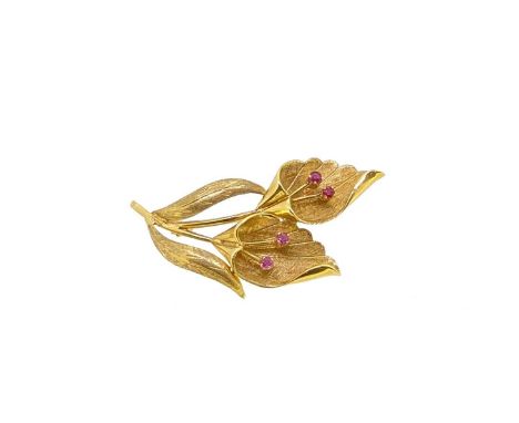 A ruby set flower brooch, two flowers, each with two claw set round faceted rubies, textured and plain polished finish, pin a
