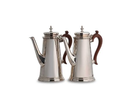 A pair of George VI silver coffee pots, mark of Nathan Bloom &amp; Son Ltd., London 1942, each of plain tapering form and in 