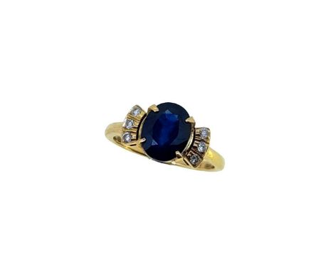 A sapphire and diamond dress ring, claw set oval faceted sapphire, approximately 8.6 x 6.7mm, estimated approximate weight 2.
