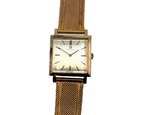 Omega - An 18ct gold wristwatch with a later bracelet, circa 1963, the signed square silvered dial, 21mm wide, with black bat