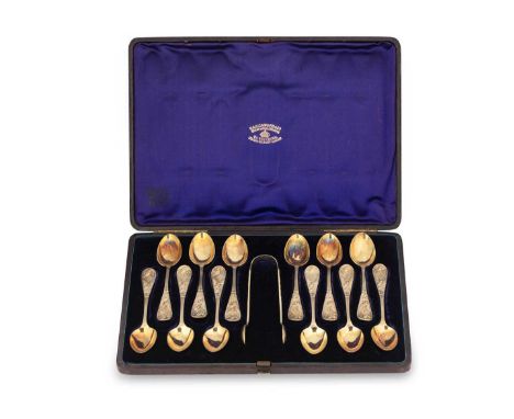 A cased set of 12 Victorian silver gilt teaspoons with tongs, mark of Holland, Son &amp; Slater (John Aldwinckle &amp; James 