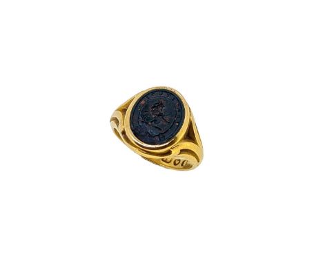 A Victorian 18ct gold bloodstone signet ring, oval shaped head, approximately 15 x 12.5mm, set with a bloodstone seal engrave
