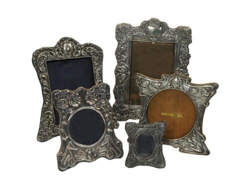 Four early 20th century silver easel back photograph frames together with a later example, the first with mark of Mappin and 