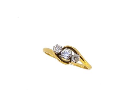 An early 20th century three stone diamond crossover ring, three claw set old European cut diamonds, estimated approximate tot