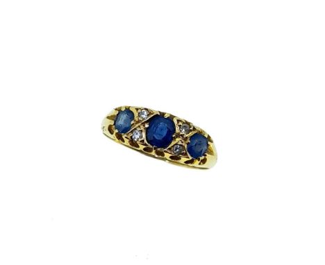 An early 20th century sapphire and diamond ring, central oval faceted sapphire, approximately 4.5 x 3.8mm, estimated approxim