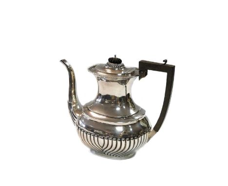 An Edward VII silver coffee pot, mark of Henry Williamson Ltd., Birmingham 1907, in the Queen Anne style, lower with gadroon 