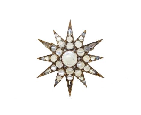A Victorian moonstone star brooch, twelve pointed star with a central round cabochon moonstone, approximate diameter 9mm, sur