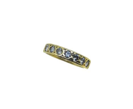 An 18ct gold seven stone diamond ring, grain set round brilliant cut diamonds, estimated approximate total diamond weight 0.6