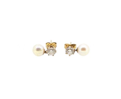 A pair of pearl and diamond ear pendants, each with a 6.7mm cultured pearl, surmounted by a claw set round brilliant cut diam