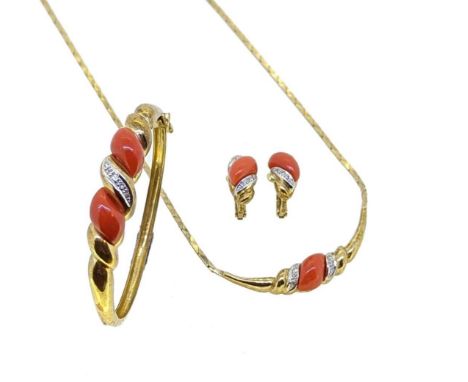 A late 20th century suite of coral jewellery, first, the necklace with cobra style links and a central section set with coral