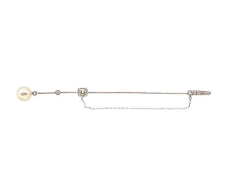 A natural saltwater pearl and diamond stick pin, button shaped pearl, diameter 8 x 8.2mm, mounted to a bar with two rubover s