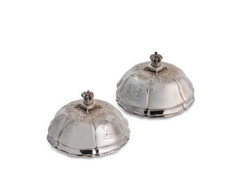 A pair of Victorian silver domed vegetable dish covers, mark of R. & S. Garrard & Co., London 1858, of circular panelled form