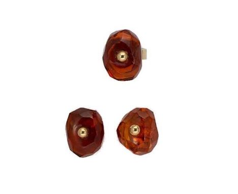 An amber ring together with a pair of ear clips, faceted amber, approximately 22 x 16.7mm, drilled through the centre and mou