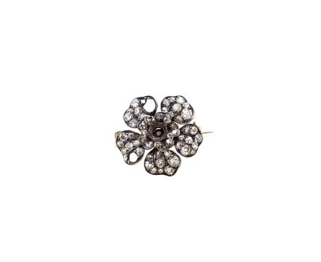 A Victorian diamond set flower brooch, centre stone missing, realistically formed petals set with graduating grain set old mi