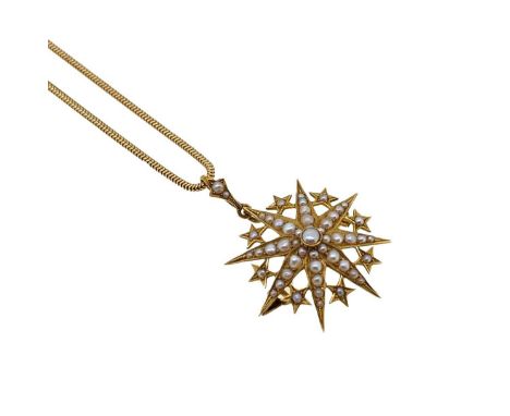 A split pearl star pendant/brooch and chain, eight pointed star, with smaller stars in between, split pearl bale, length incl