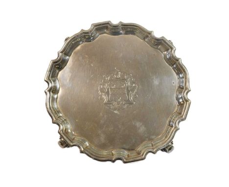A George II silver waiter, mark of Denis Langton, London 1736, 'Chippendale' style, the field engraved with the arms of KNIGH