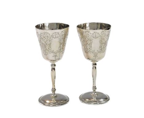 A pair of Elizabeth II silver sherry goblets, mark of Charles S. Green &amp; Co. Ltd., Birmingham 1969, each of campana form 