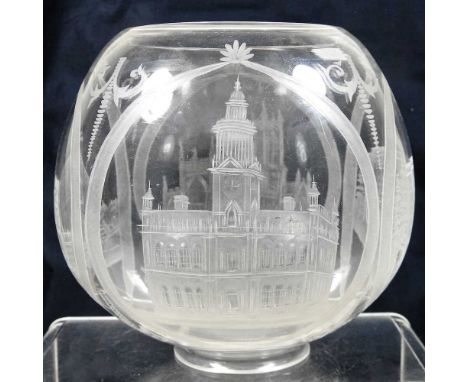 A clear glass oil lamp shade, engraved with churches and buildings, 15cm highCondition report: Overall appears to be intact. 