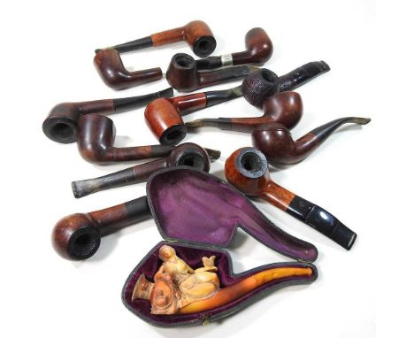 A carved meerschaum pipe, in the form of a young lady reclining on a vase, 14cm long, in a fitted case, together with a colle