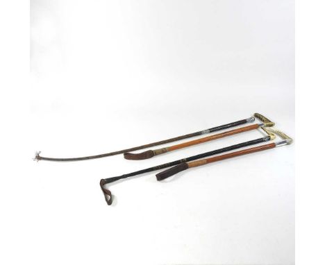 A Victorian silver mounted hunting crop, London 1895, 87cm long, together with three other riding crops (4)