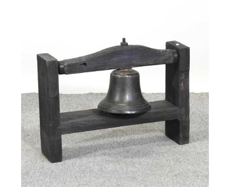 A 19th century school bell, on a later wooden stand, 61cm