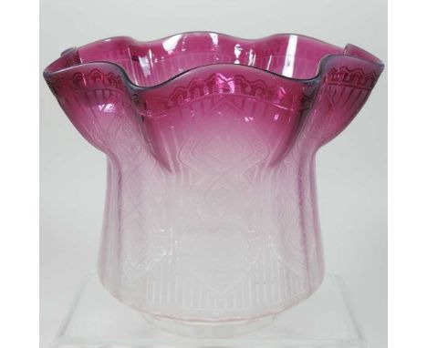 A glass oil lamp shade, with a frilled purple rim and etched decoration, 18cm highCondition report: 10cm aperture. No visible
