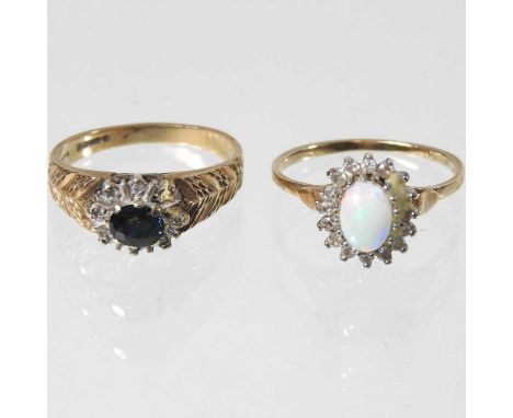 A 9 carat gold opal cluster ring, size O, together with a textured gold cluster ring, 5.6g gross (2)