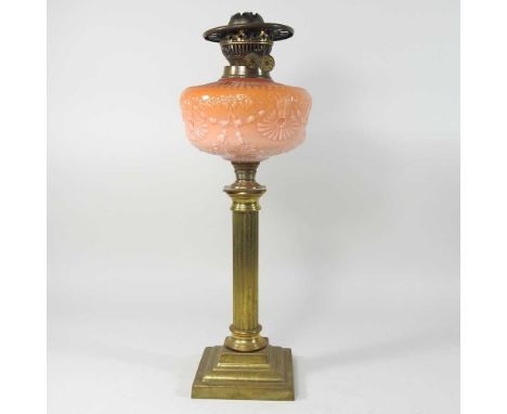 A 19th century brass oil lamp base, with a peach coloured glass font, 50cm highCondition report: Reservoir looks intact, with