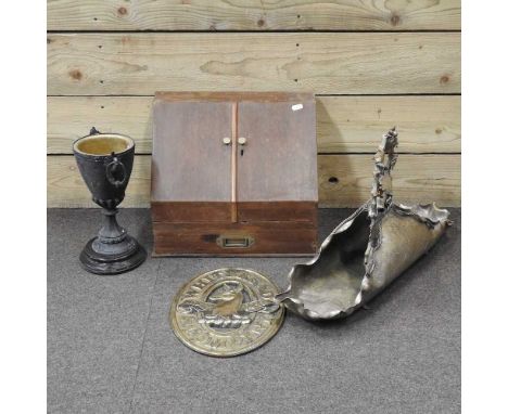 A Whitbread brass advertising panel, together with an ornate brass trug, with vine decoration, a spelter oil lamp base and a 