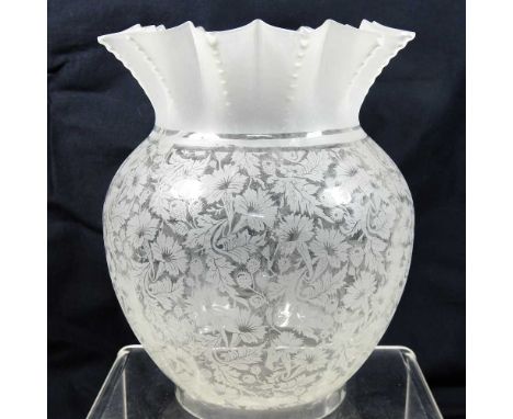 A clear glass oil lamp shade, with a frilled rim, finely etched with all over flowers, 20cm highCondition report: Small chip 