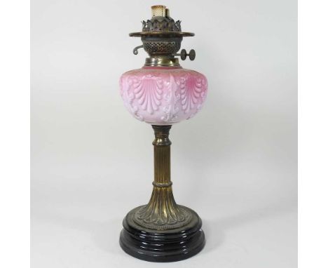 A 19th century brass oil lamp base, with a pink opaline reservoir, 43cm highCondition report: Appears to be complete, with no