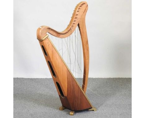 A mid 20th century walnut harp, 117cm high