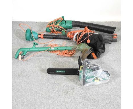A petrol chainsaw, together with a strimmer, a leaf blower and another (4)