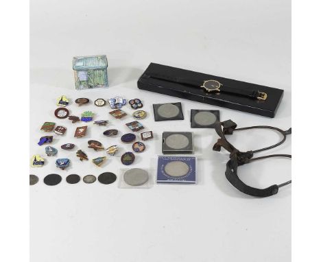 A Movado museum watch, cased, together with a collection of Butlins badges and a pair of spurs